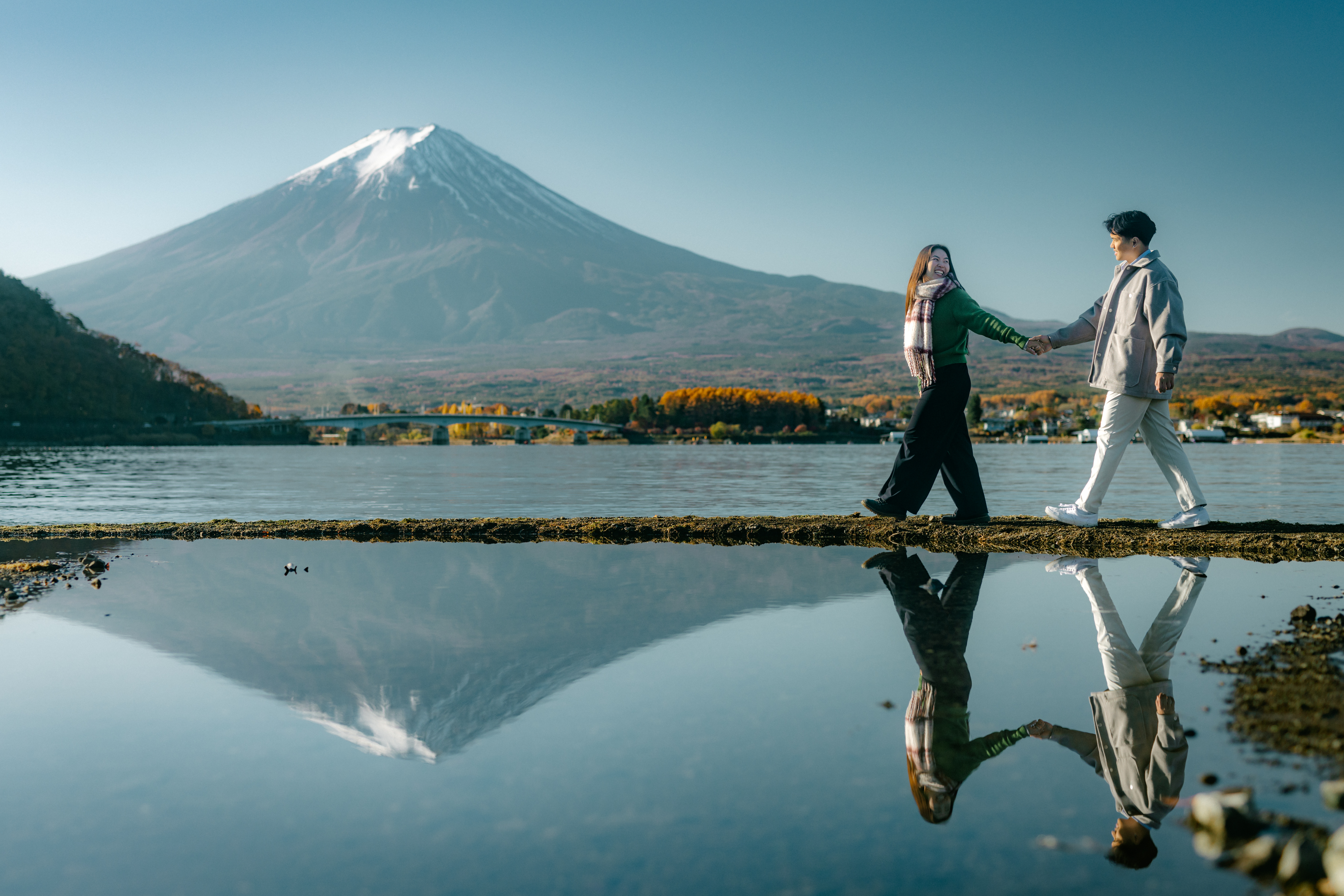 Vivi and Hung jumping in front of Mt. Fuji